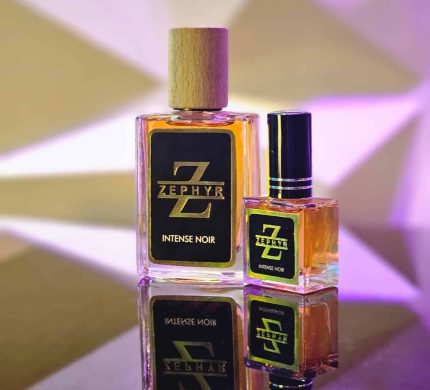Zephyr Intense Noir Eau De Parfum premium transparent glass bottles in 30ml with wooden cap and 10ml with black cap on a reflective surface.